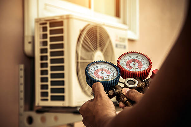 Professional Ac Installation technician working in Elm Springs, AR